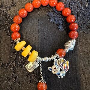 Red and Yellow Beaded Bracelet with Charms